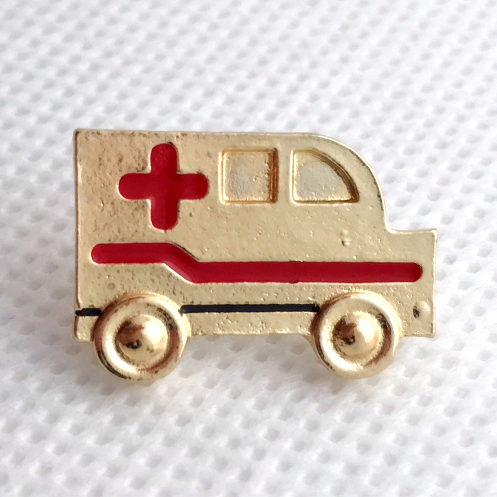 gold ambulance pin